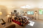 The second bedroom features a queen bed and a twin